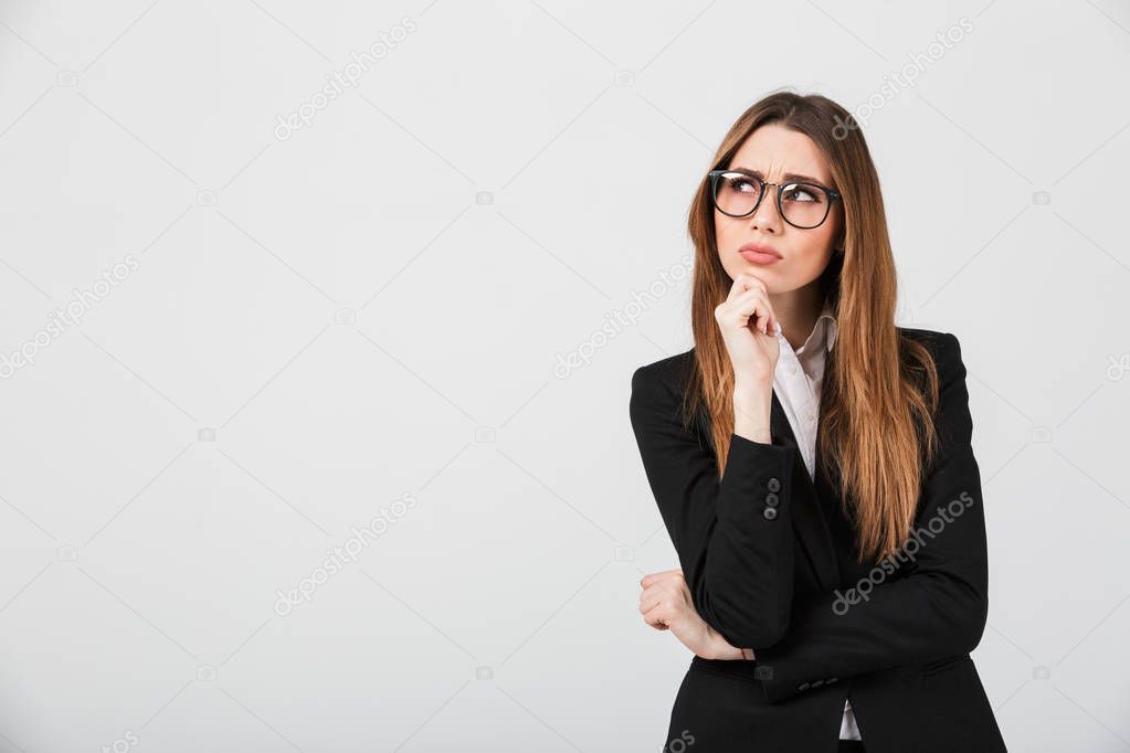 Portrait of a thoughtful businesswoman dressed in suit