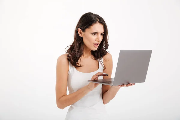 Portrait of a confused girl dressed in tank-top — Stock Photo, Image