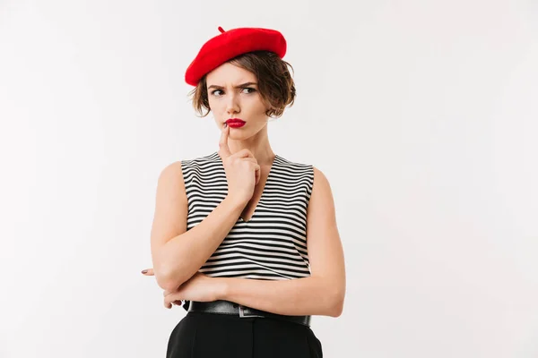 Portret kobiety zamyślony noszenie czerwony beret — Zdjęcie stockowe
