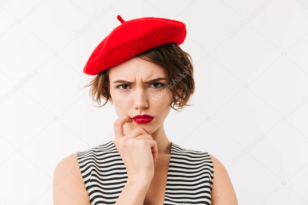 Portrait of an upset woman dressed in red beret