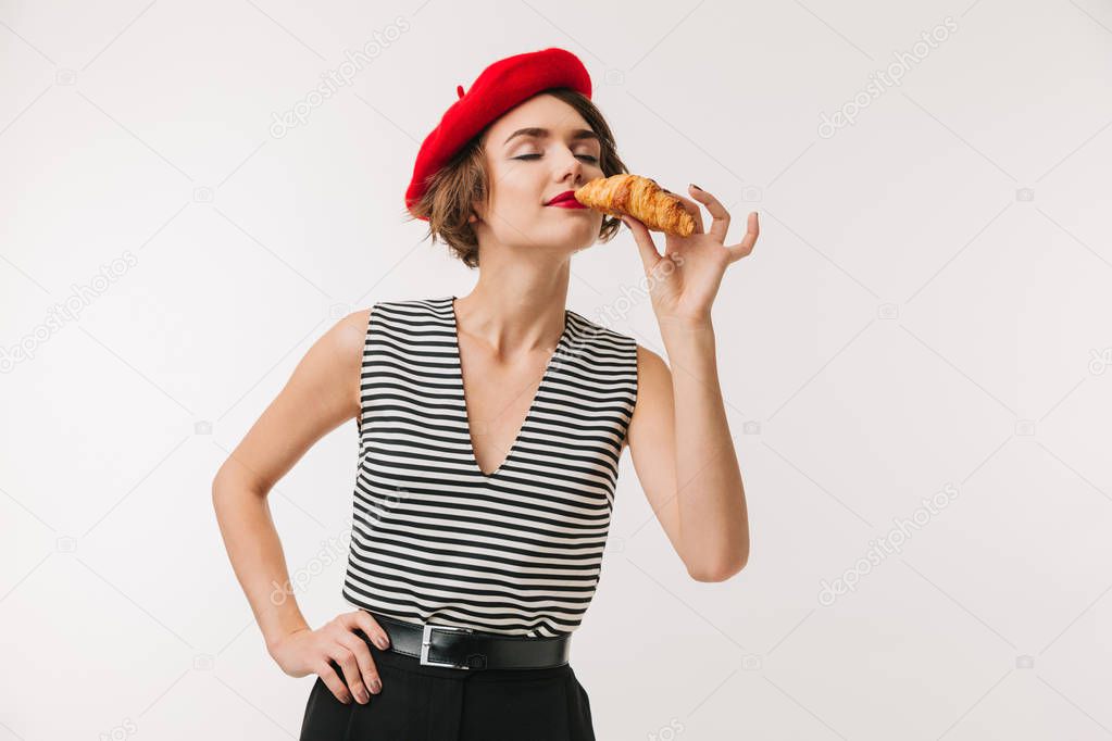 Portrait of a delighted woman wearing red beret