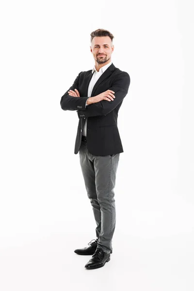 Full-length portrait of handsome businessman in suit posing on c — Stock Photo, Image