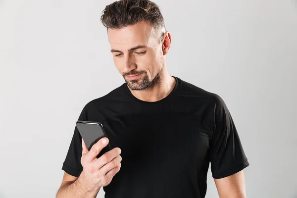 Full length portrait of a smiling mature sportsman — Stock Photo, Image