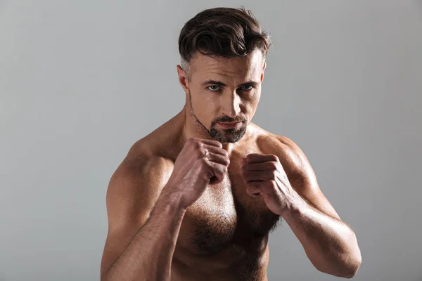 Close up portrait of a strong mature shirtless sportsman boxing — Stock Photo, Image