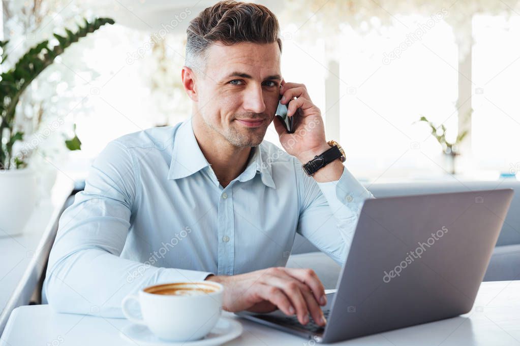 Portrait of a smiling mature man talking on mobile phone