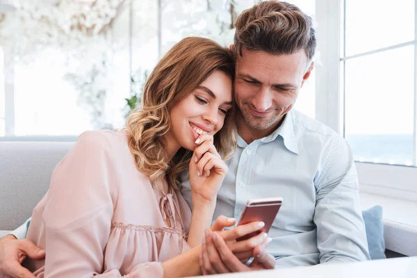 Family portrait of happy couple man and woman resting in restaur