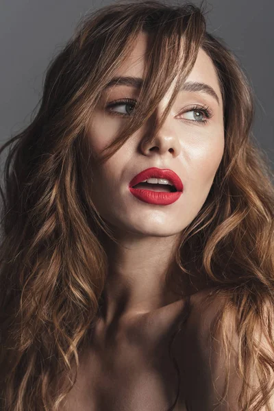 Fashion portrait of a beautiful shirtless curly brown hair woman — Stock Photo, Image