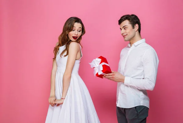 Fun expression young couple in black clothes shirt dress celebrating  birthday holiday party isolated on bright red background. St Valentine  International Women Day Happy New Year 2019 concept. Mock up Stock Photo |