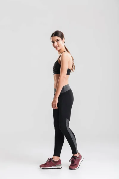 Full-length photo of sporty slim woman wearing tracksuit and loo — Stock Photo, Image