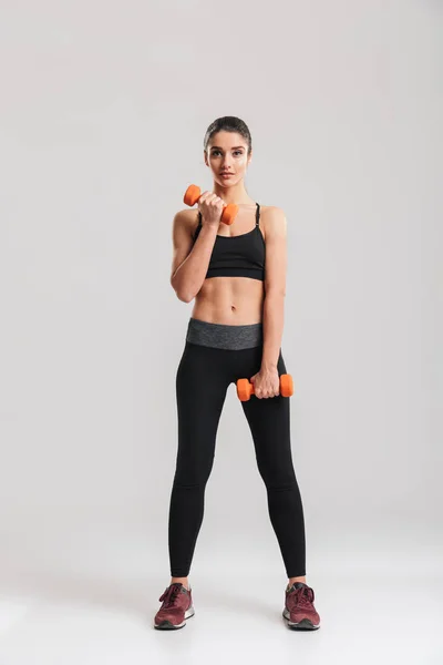 Full-length photo of sporty slim woman doing exercises with smal — Stock Photo, Image