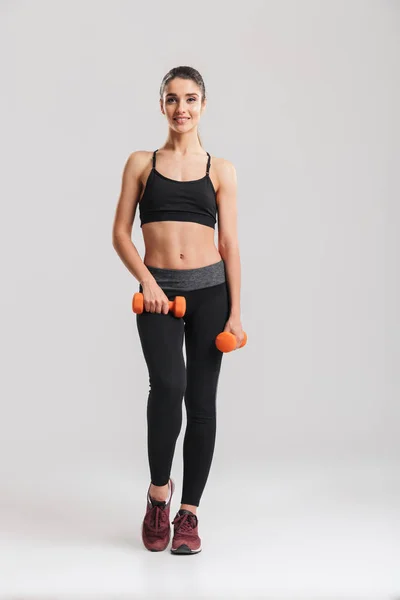 Full-length photo of gorgeous slim woman smiling and doing exerc — Stock Photo, Image