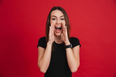 Portrait of an excited casual girl shouting clipart