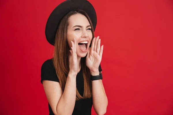 Portrait of a happy stylish girl wearing hat shouting — Stock Photo, Image