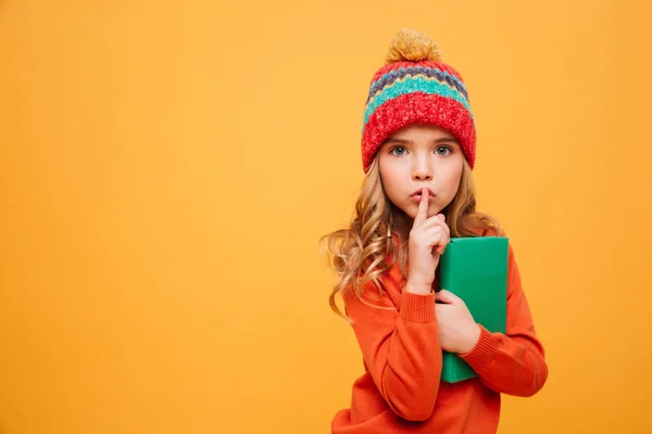 Mystery Young girl in sweater and hat holding book — Stock Photo, Image