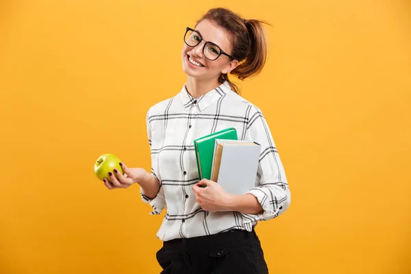 Photo of happy smiling woman posing at camera with books and rip — Stock Photo, Image