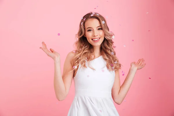 HAppy young woman over confetti. Looking aside. — Stock Photo, Image