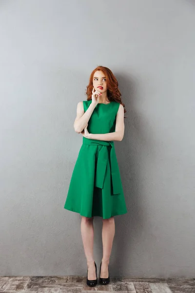 Thoughtful redhead young lady — Stock Photo, Image