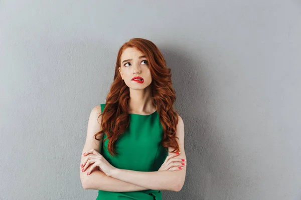 Thoughtful redhead young lady — Stock Photo, Image
