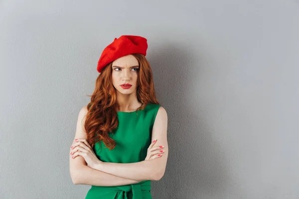 Redhead young angry lady in green dress — Stock Photo, Image