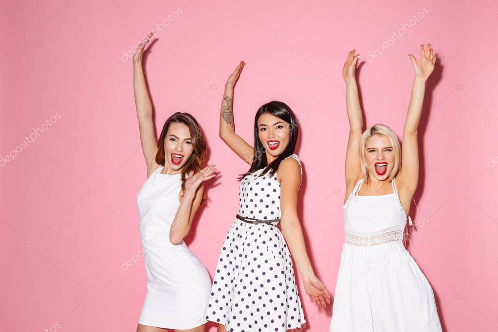 Three young excited girls friends