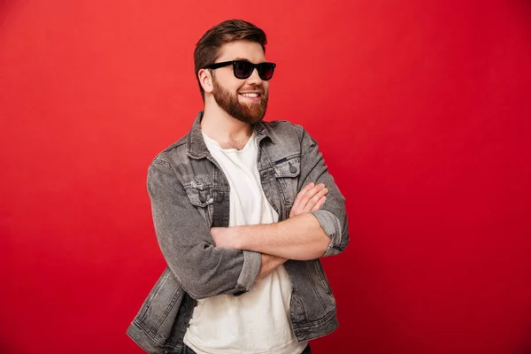 Image of fashion young man wearing sunglasses and denim smiling — Stock Photo, Image