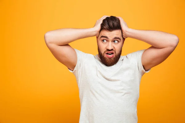 Portrait of a puzzled bearded man — Stock Photo, Image