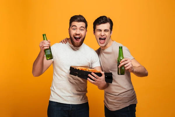 Portrait of a two excited young men watching football — Stock Photo, Image