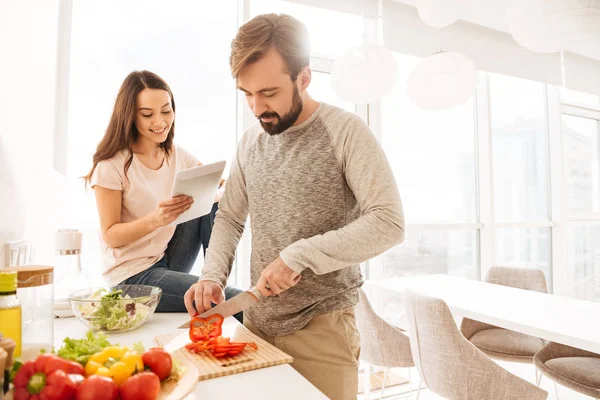 Portrait of a smiling young couple cooking — Stock Photo, Image