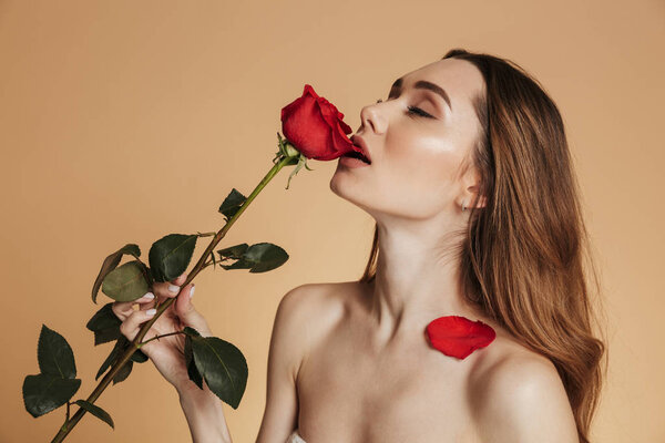 Portrait of a shirtless sexy young girl with long brown hair
