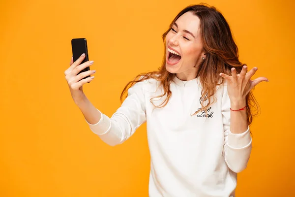 Excited emotional young woman make selfie by mobile phone. — Stock Photo, Image