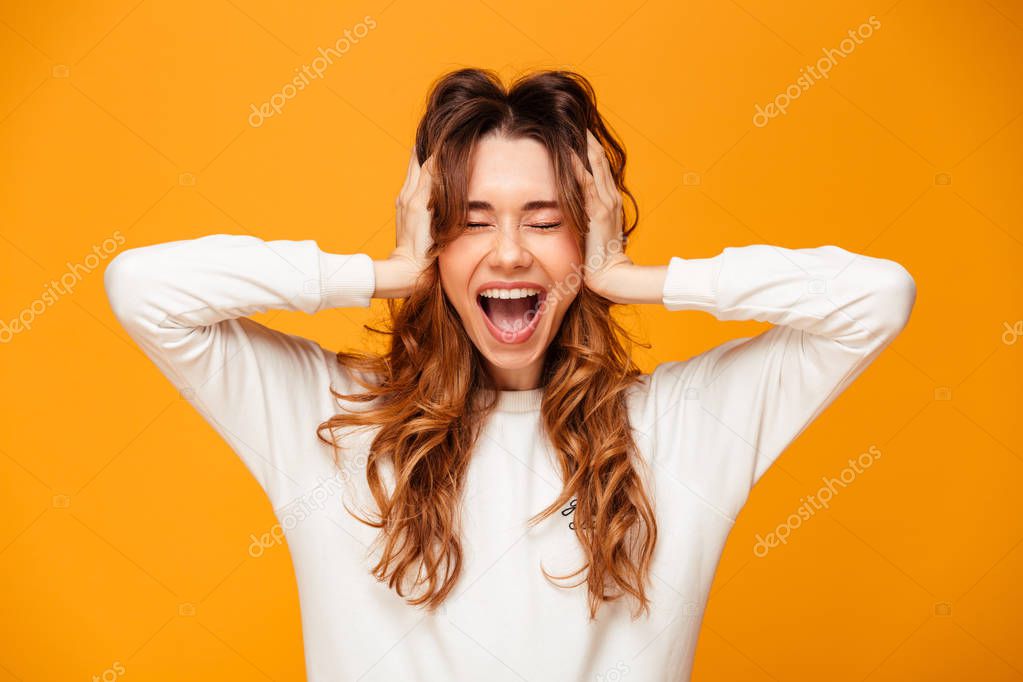Excited screaming young woman