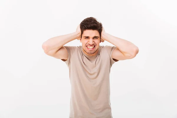 Photo of distressed emotional man 30s grabbing his head or cover — Stock Photo, Image