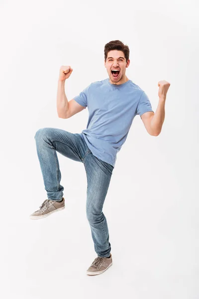 Full-length photo of happy man 30s in casual t-shirt and jeans r — Stock Photo, Image