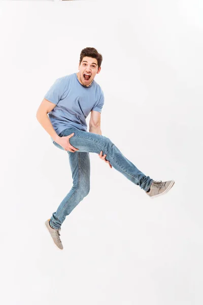 Full-length photo of amusing guy in casual t-shirt and jeans hol — Stock Photo, Image