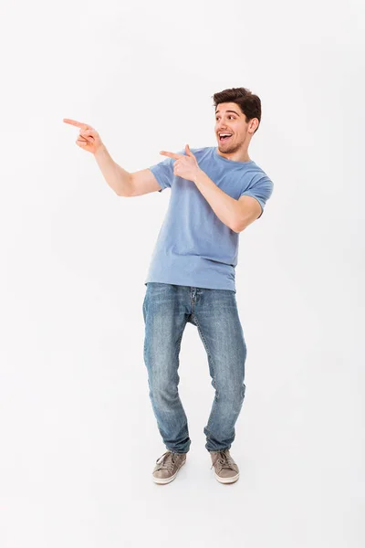 Full-length photo of splendid man rejoicing and pointing fingers — Stock Photo, Image