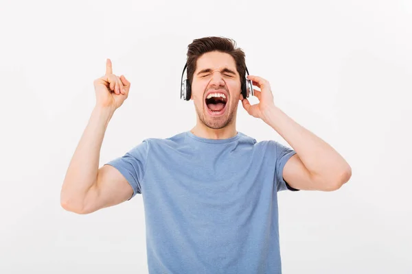 Portrait of happy man having short dark hair screaming his favor — Stok Foto