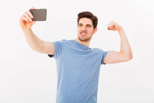 カメラの t シャツ: 表示中の上腕の筋肉強者の写真 — ストック写真