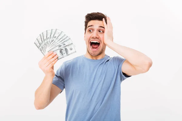 Photo of lucky rich guy in casual t-shirt screaming and rejoicin — Stock Photo, Image