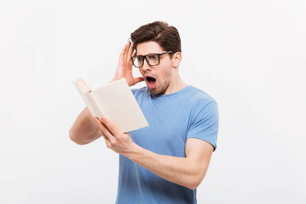 Photo of intellectual guy wearing eyeglasses reading book in out — Stock Photo, Image