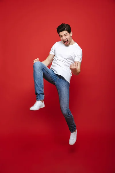 Full length portrait of a cheerful young man — Stock Photo, Image