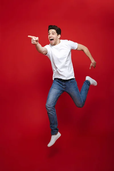 Full length portrait of an excited young man — Stock Photo, Image