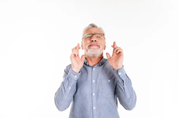 Old bearded man making pray gesture and looking up with closed eyes isolated — Stock Photo, Image