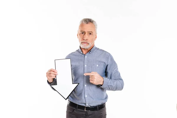 Sad man holding arrow down and looking camera isolated — Stock Photo, Image