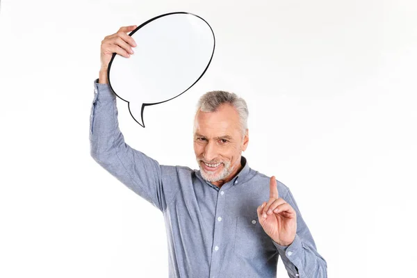 Pleased mature man holding blank bubble speech isolated — Stock Photo, Image