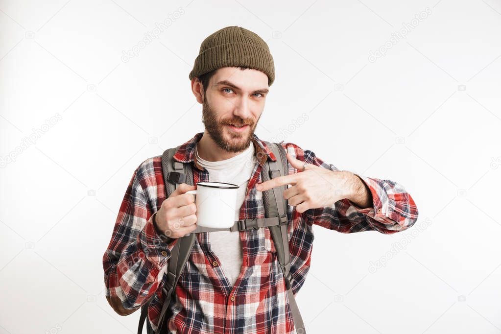 Portrait of a confident bearded man tourist in plaid shirt