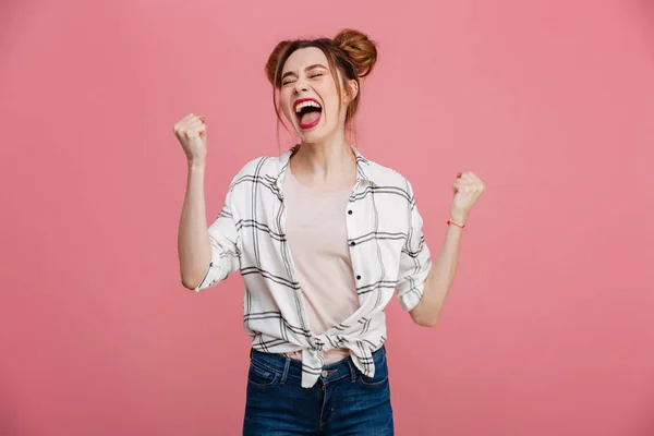 Portrait of an excited young girl celebrating success