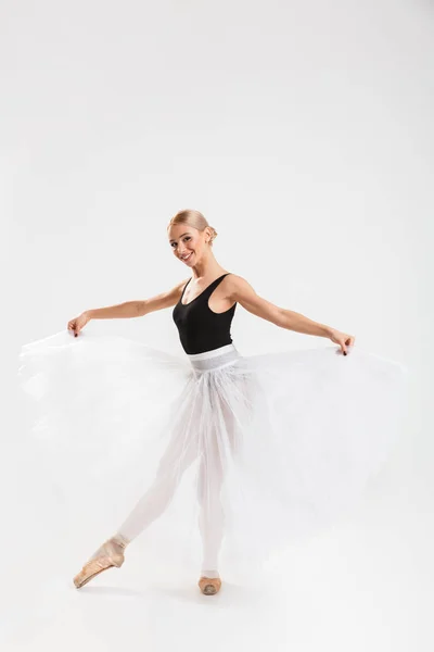 Cheerful young woman ballerina dancing — Stock Photo, Image