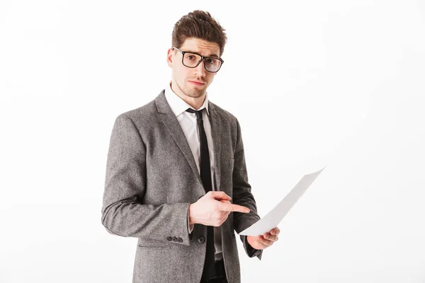 Young business man in jacket and eyeglasses holding documents — Stock Photo, Image