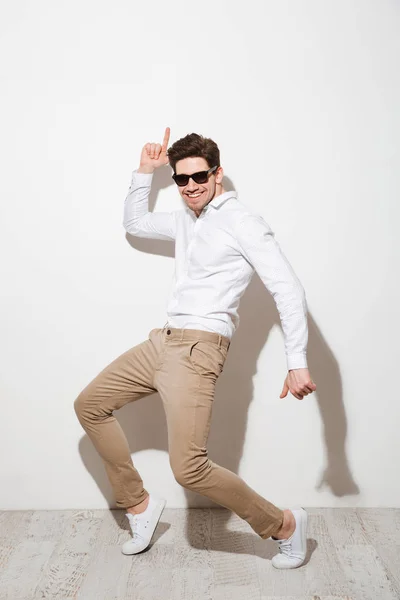 stock image Full length portrait of a joyful young man