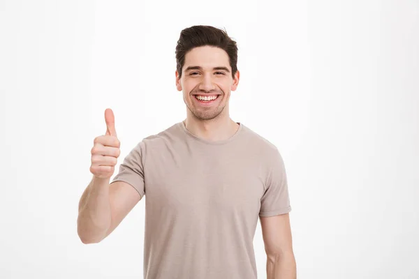 Photo of attractive man 30s having stubble showing thumb up on c — Stock Photo, Image